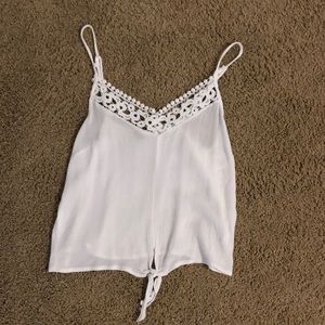Whit tie front with lace tank top. Adjustable straps.